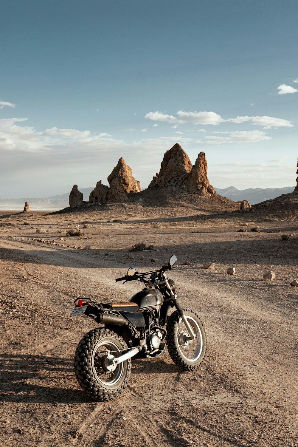 Scrambler among desert rock pinnacles at dawn